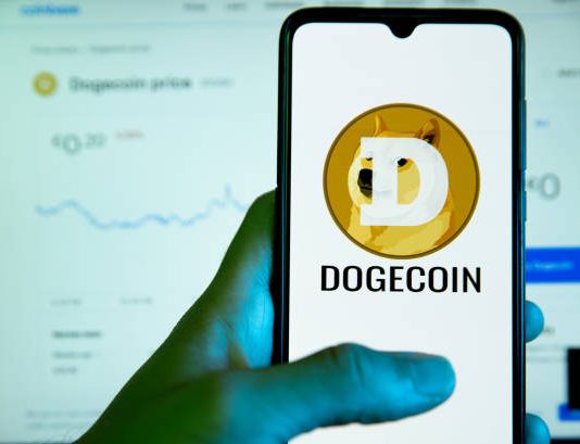 Dogecoin Caught In Compression: Descending Triangle Warns Of Potential Collapse